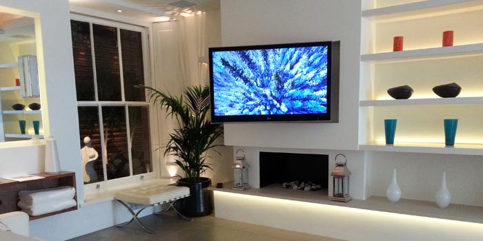 TV mounted on the wall in a lounge