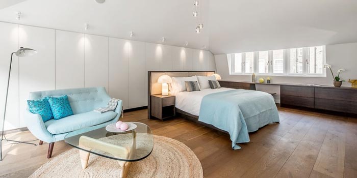 Well lit, open plan bedroom at day time