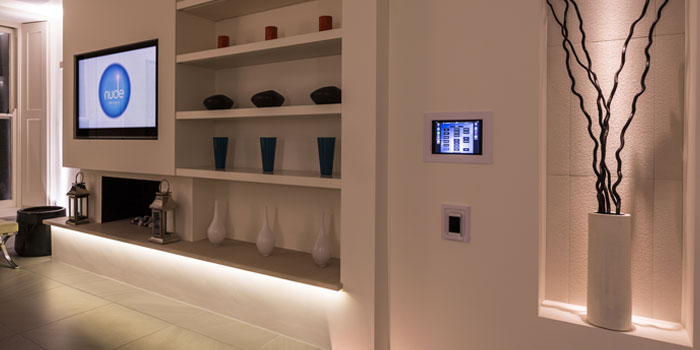 Lighting controls mounted on the wall in a modern lounge